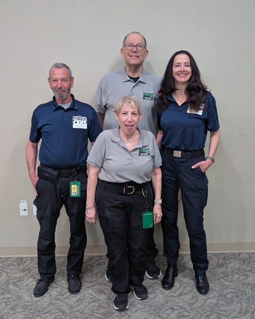 Four members of the newly elected Montgomery County CERT Board of Directors for 2026–2027 pose together indoors wearing CERT uniforms.